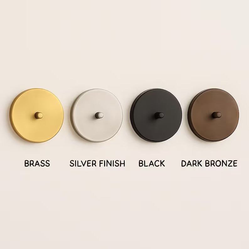 Metal finish options for wall sconces including brass, silver, black, and dark bronze
